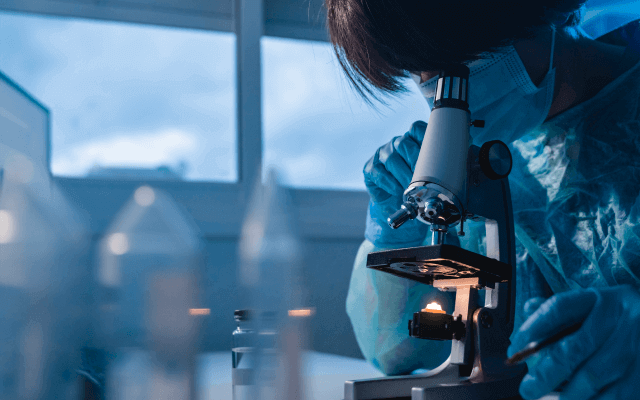 Photo of scientist using a microphone